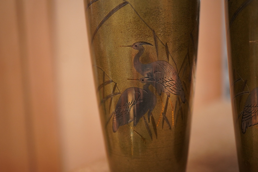 A pair of Japanese Meiji period bronze vases with crane decoration, 15cm high